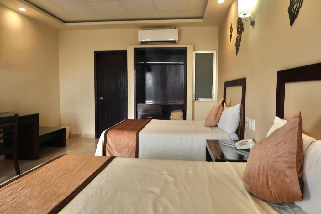 Letto o letti in una camera di Hotel Yorio Inn