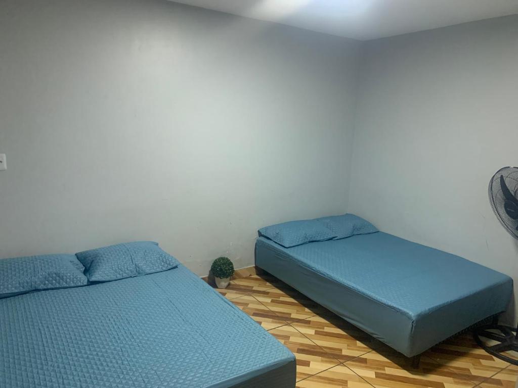 Ένα ή περισσότερα κρεβάτια σε δωμάτιο στο Paraíso hostel