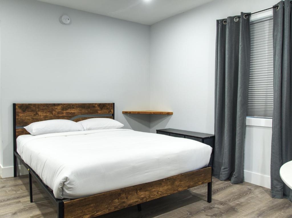 Postel nebo postele na pokoji v ubytování Vermont Suites