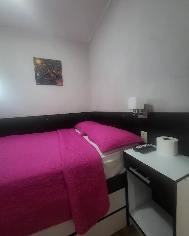 Postel nebo postele na pokoji v ubytování Habitaciones R-1