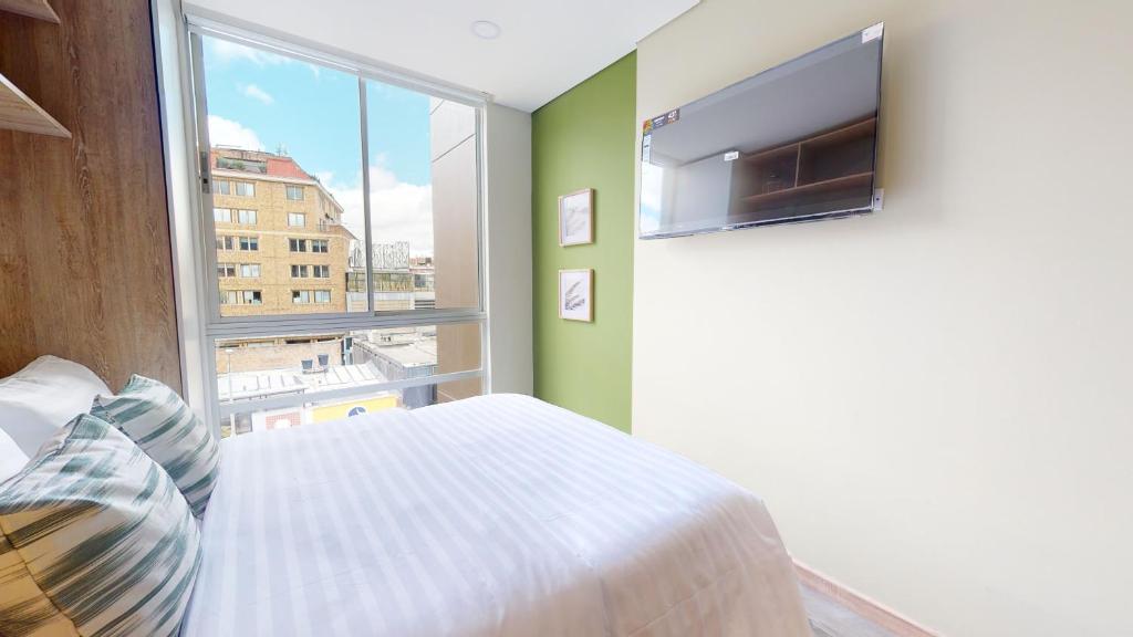 TV a/nebo společenská místnost v ubytování The Cabrera Eighty Fifth Hotel
