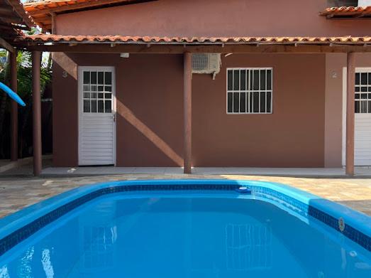 Bazén v ubytování CASAS com PISCINA SENSACIONAIS NO CENTRO - Residencial Tchê nebo v jeho okolí