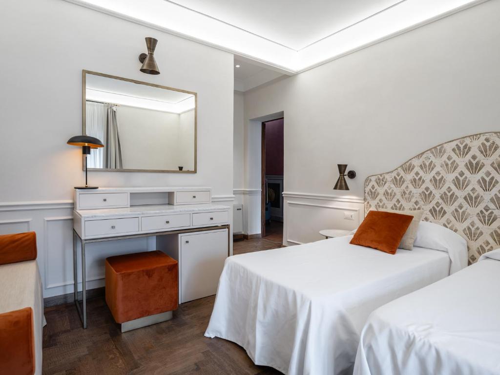 Postel nebo postele na pokoji v ubytování Albergo Chiusarelli