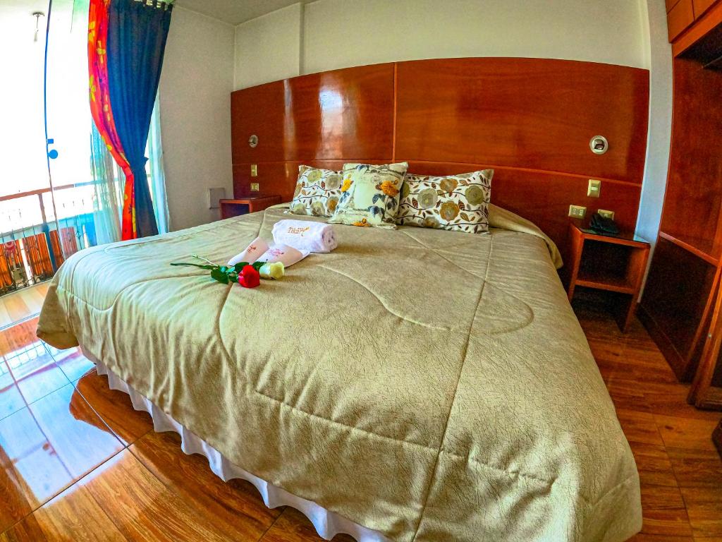 Ένα ή περισσότερα κρεβάτια σε δωμάτιο στο Hotel Tikary