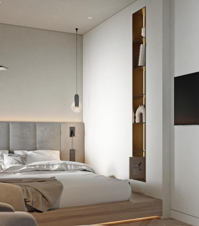 Postel nebo postele na pokoji v ubytování Hotel Laudon