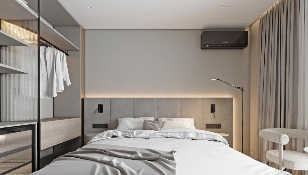 Postel nebo postele na pokoji v ubytování Hotel Laudon