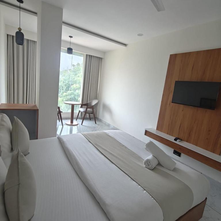 Postel nebo postele na pokoji v ubytování Hotelmaple tree
