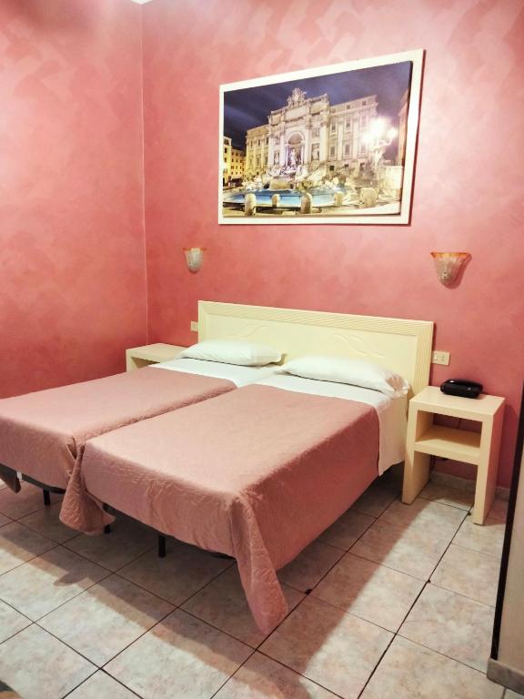 Postel nebo postele na pokoji v ubytování Hotel PRINCIPE AMEDEO