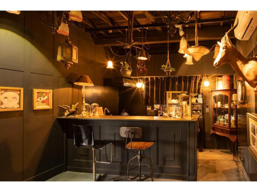 a bar in a restaurant with two stools at Hyohaku - Vacation STAY 61130v in Ichinomiya