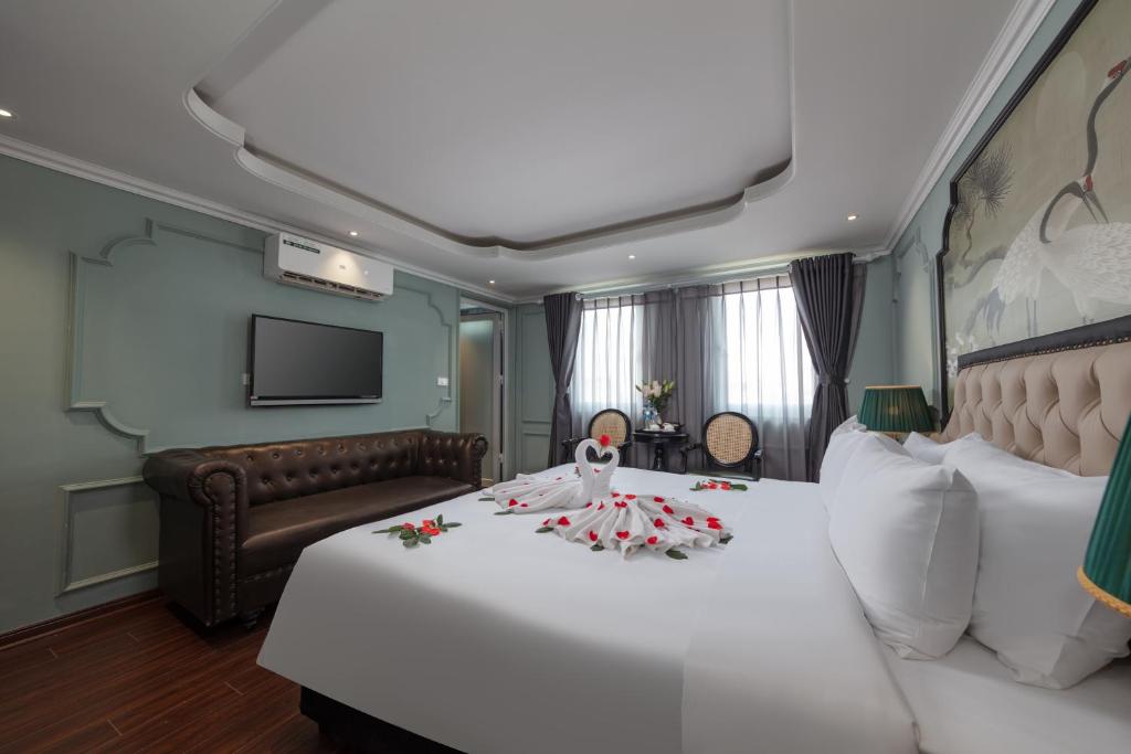 Postel nebo postele na pokoji v ubytování Madelise Grand Hotel