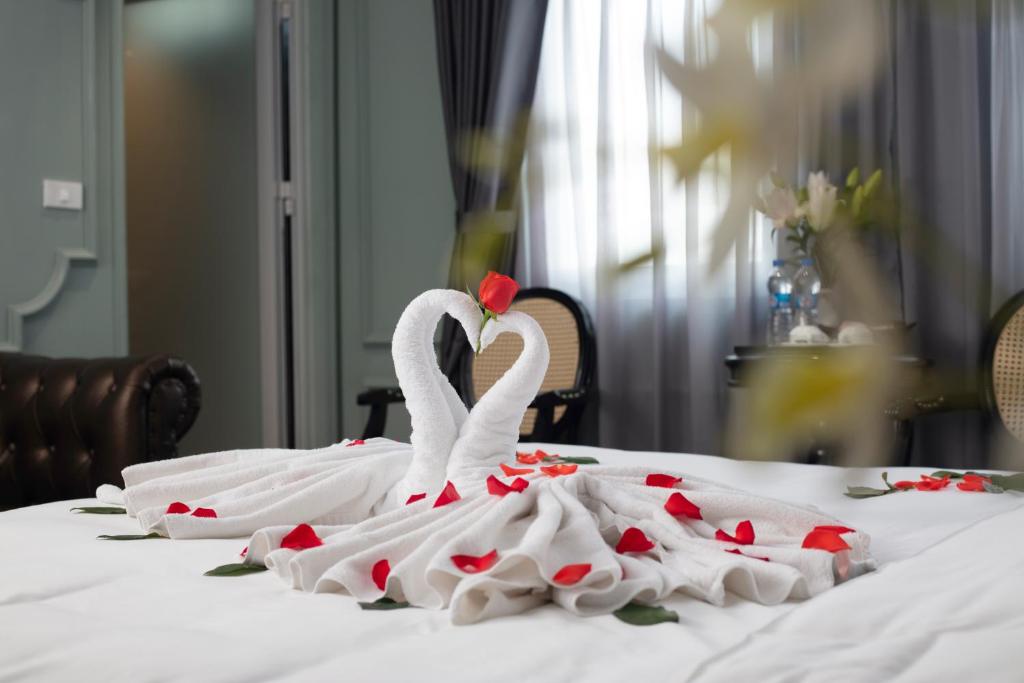 Postel nebo postele na pokoji v ubytování Madelise Grand Hotel