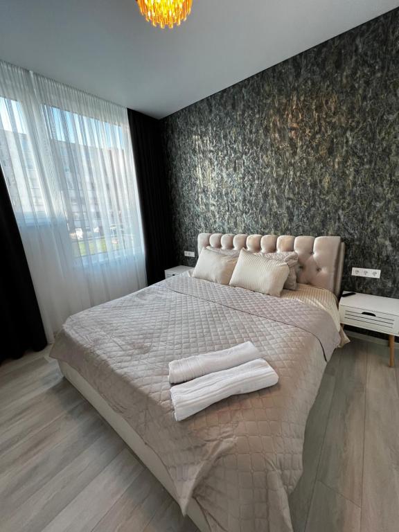 Ένα ή περισσότερα κρεβάτια σε δωμάτιο στο Chic Residence apartament 4