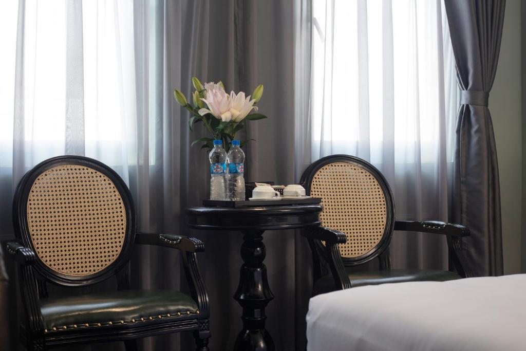 Postel nebo postele na pokoji v ubytování Madelise Grand Hotel