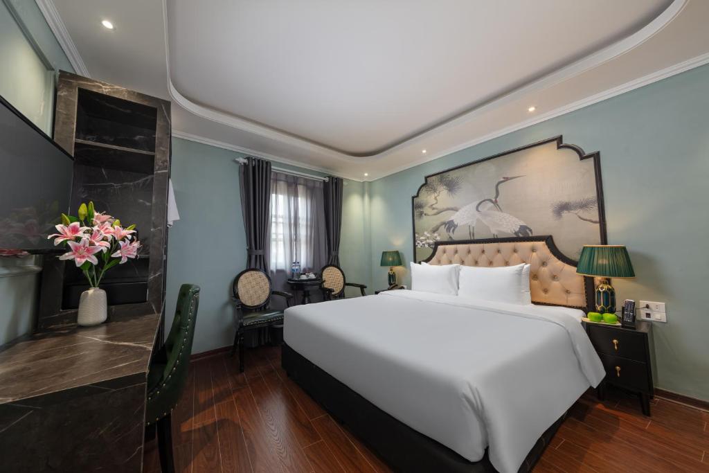 Postel nebo postele na pokoji v ubytování Madelise Grand Hotel