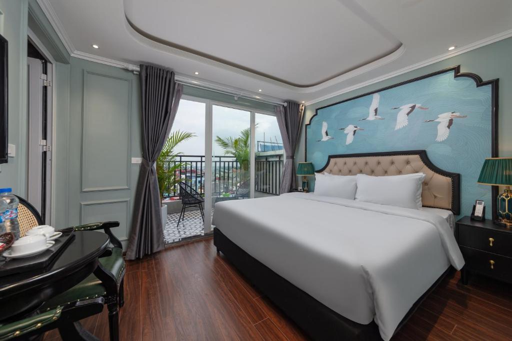 Postel nebo postele na pokoji v ubytování Madelise Grand Hotel