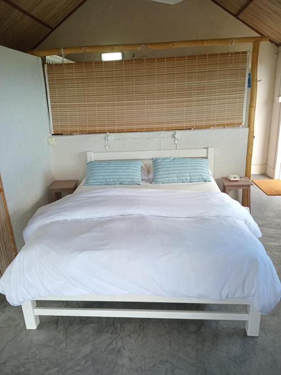 Postel nebo postele na pokoji v ubytování Fantaisie Lodges