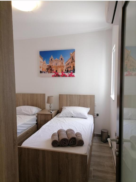 Postel nebo postele na pokoji v ubytování Bright and Convenient Penthouse in Central Malta