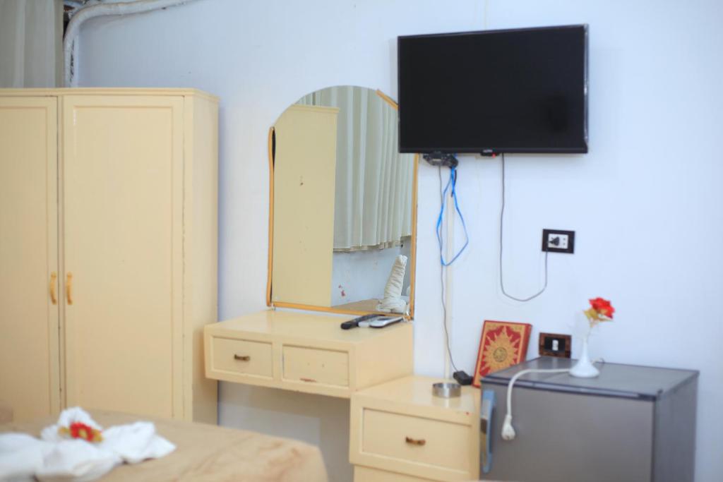TV a/nebo společenská místnost v ubytování Oscar Hotel