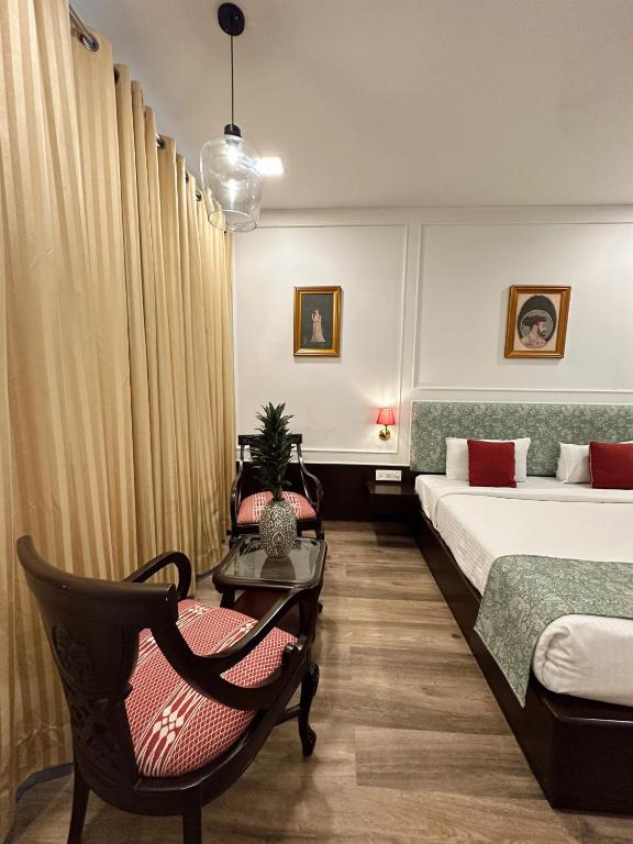 Postel nebo postele na pokoji v ubytování Hotel Atulyaa Taj