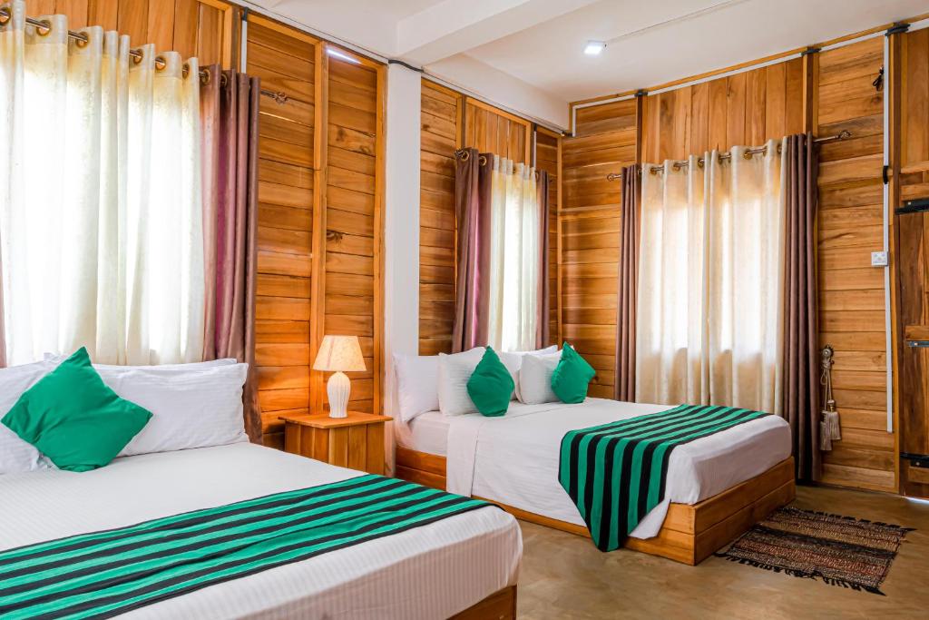 Postel nebo postele na pokoji v ubytování Rock Shade Chalet- Sigiriya
