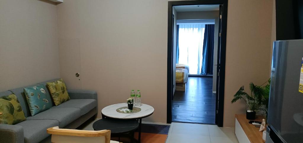 TV a/nebo společenská místnost v ubytování AeonTower Suites&Hotel by CMC