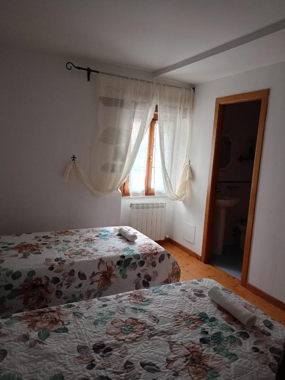 Postel nebo postele na pokoji v ubytování Hostal del Camino de Santiago
