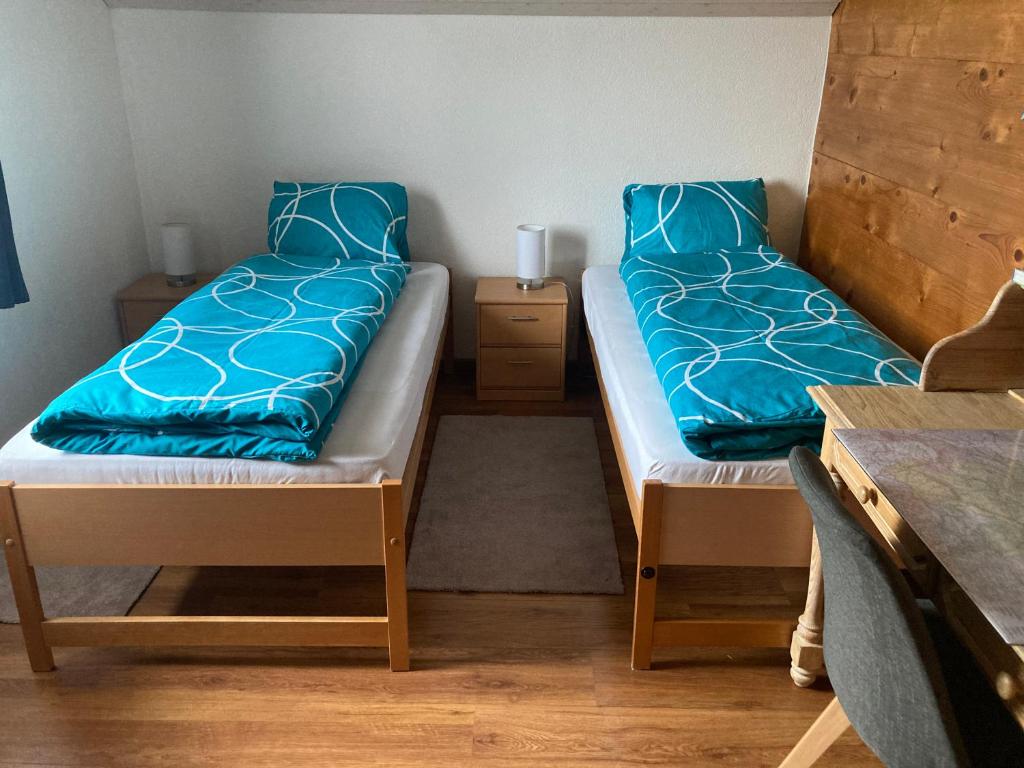 Postel nebo postele na pokoji v ubytování Haus Dorfblick