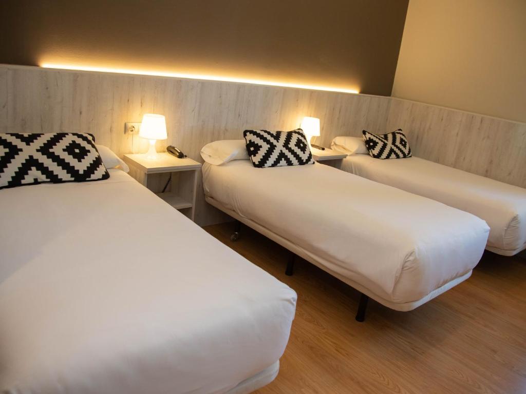 Postel nebo postele na pokoji v ubytování Hotel Restaurante Cadosa