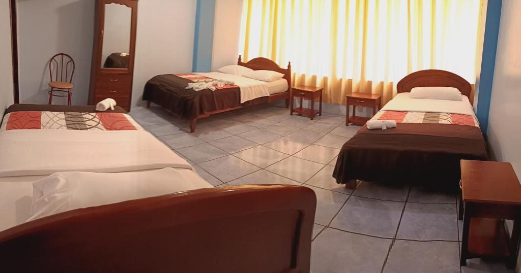 Postel nebo postele na pokoji v ubytování Hostal mariajose baños