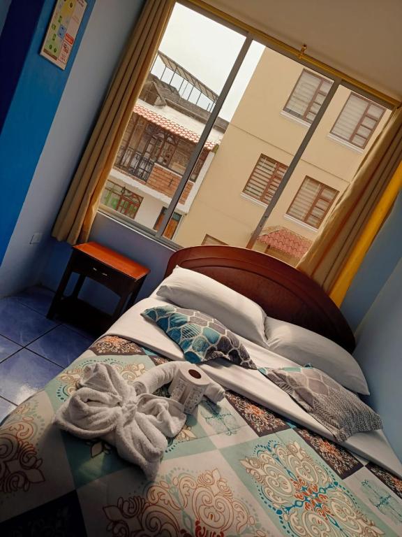 Postel nebo postele na pokoji v ubytování Hostal mariajose baños