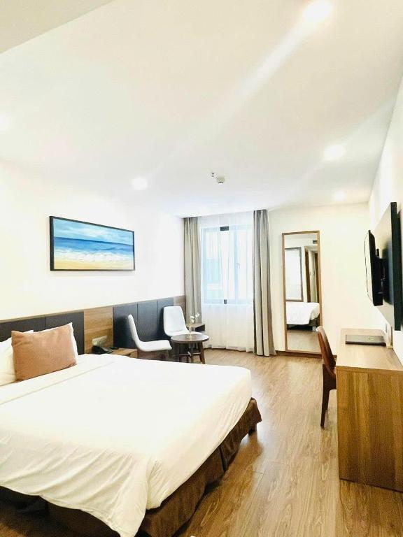 Postel nebo postele na pokoji v ubytování Amunra Ocean Hotel