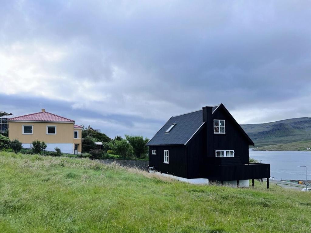Image showcasing Charming 3-Bedroom Home with Stunning Fjord Views, Tvøroyri (updated ...