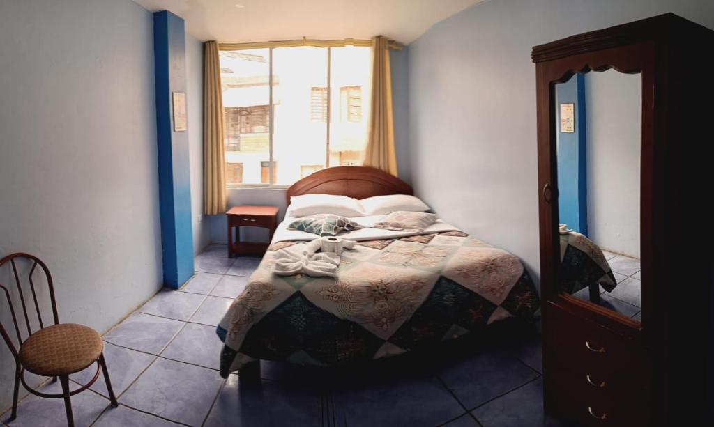 Postel nebo postele na pokoji v ubytování Hostal mariajose baños
