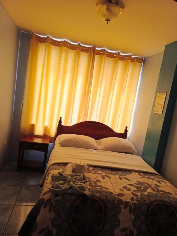 Postel nebo postele na pokoji v ubytování Hostal mariajose baños