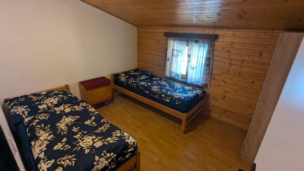 Postel nebo postele na pokoji v ubytování U Kodrů