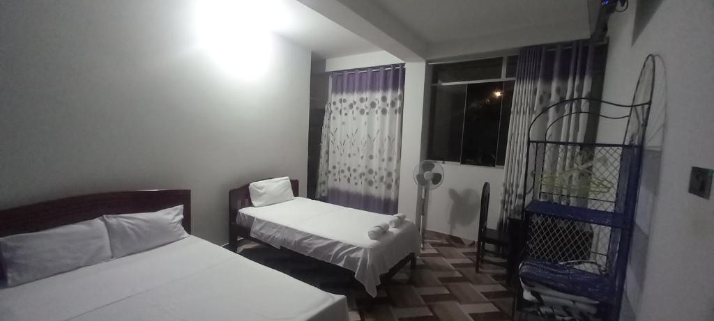 Postel nebo postele na pokoji v ubytování Hospedaje Miraflores