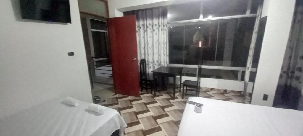 Postel nebo postele na pokoji v ubytování Hospedaje Miraflores