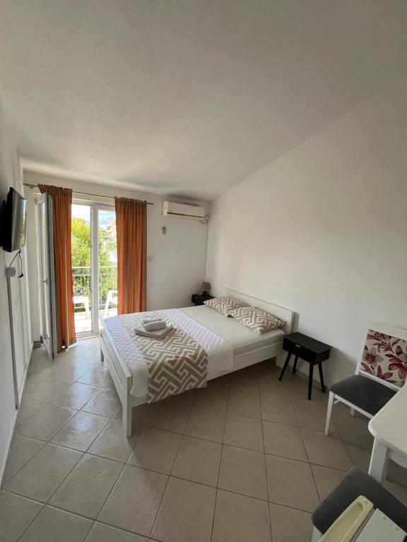 Postel nebo postele na pokoji v ubytování Apartmani Bekonja