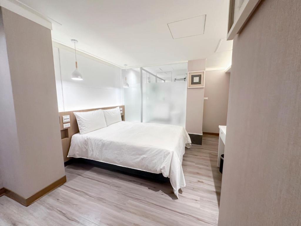 Postel nebo postele na pokoji v ubytování Days Fine Hotel