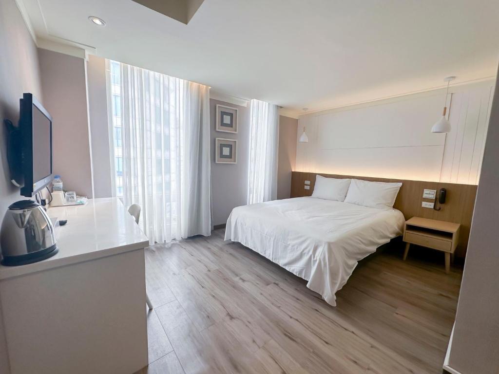 Postel nebo postele na pokoji v ubytování Days Fine Hotel