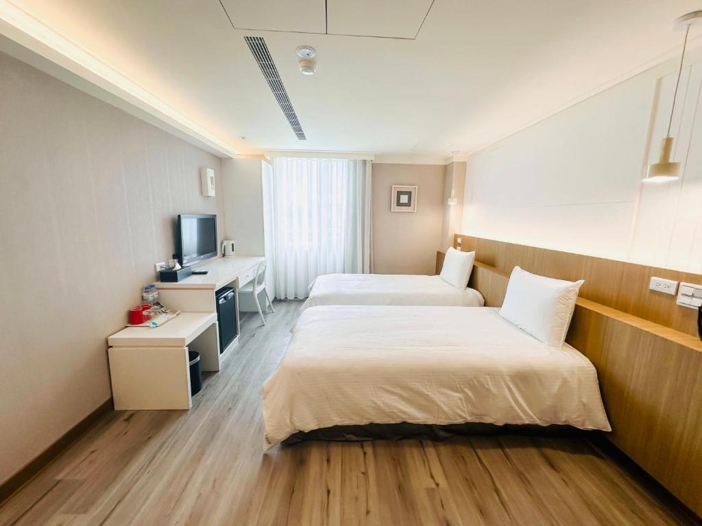Postel nebo postele na pokoji v ubytování Days Fine Hotel