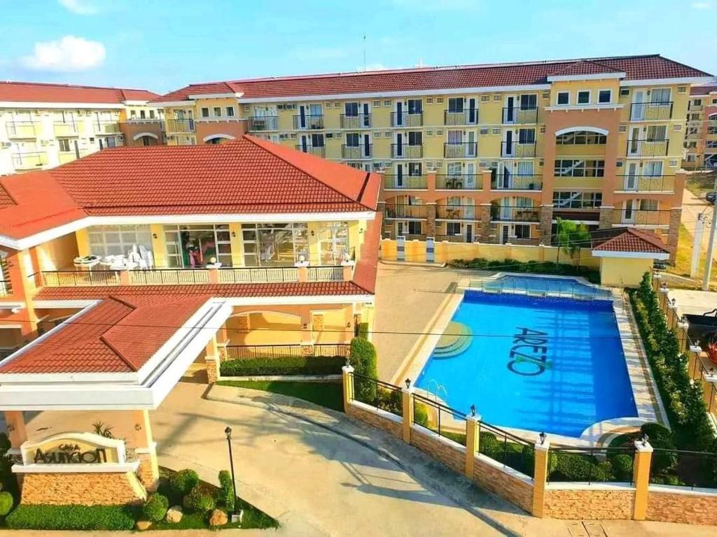 an overhead view of a large apartment complex with a swimming pool at Your Davao Home, Awaits You at Arezzo Place Davao! in Sasabayou