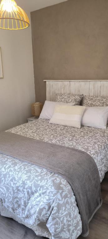 Postel nebo postele na pokoji v ubytování Appartement sous les remparts