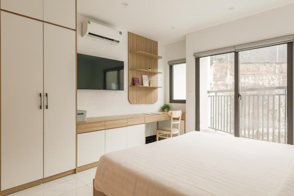 Postel nebo postele na pokoji v ubytování Dodo home AC