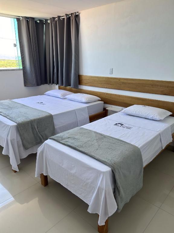 Postel nebo postele na pokoji v ubytování Hotel Beira do Rio