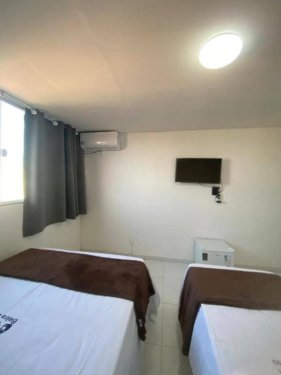 Postel nebo postele na pokoji v ubytování Hotel Beira do Rio