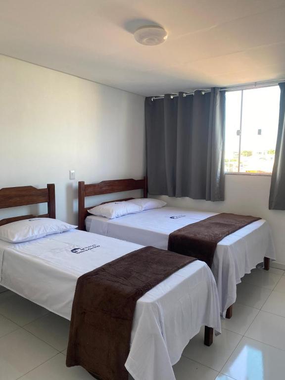 Postel nebo postele na pokoji v ubytování Hotel Beira do Rio