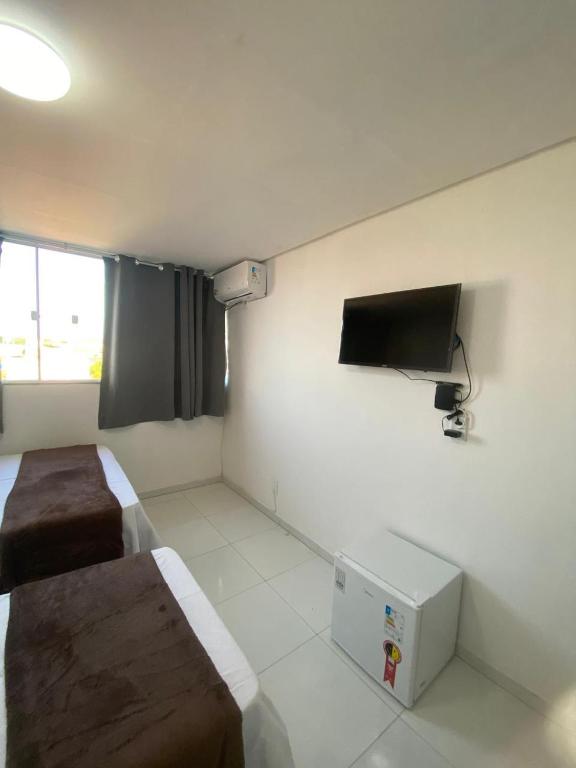 TV a/nebo společenská místnost v ubytování Hotel Beira do Rio