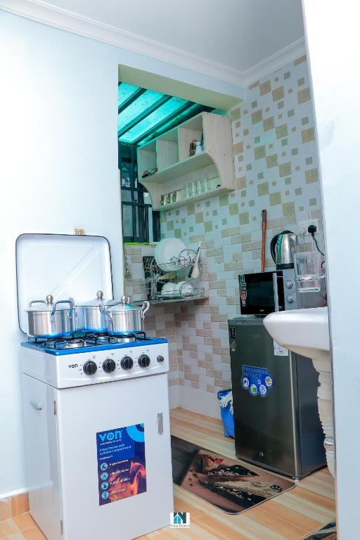 Kuchyň nebo kuchyňský kout v ubytování Neim Homes
