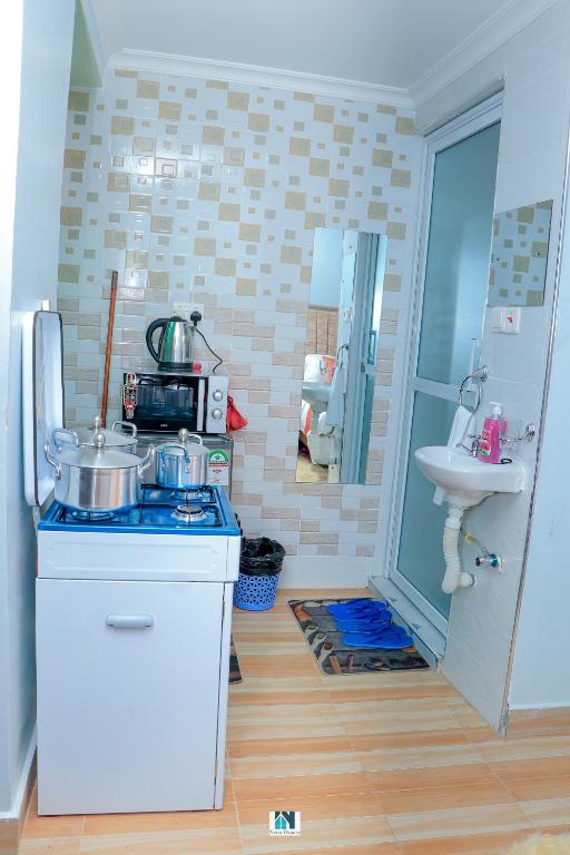 Kuchyň nebo kuchyňský kout v ubytování Neim Homes